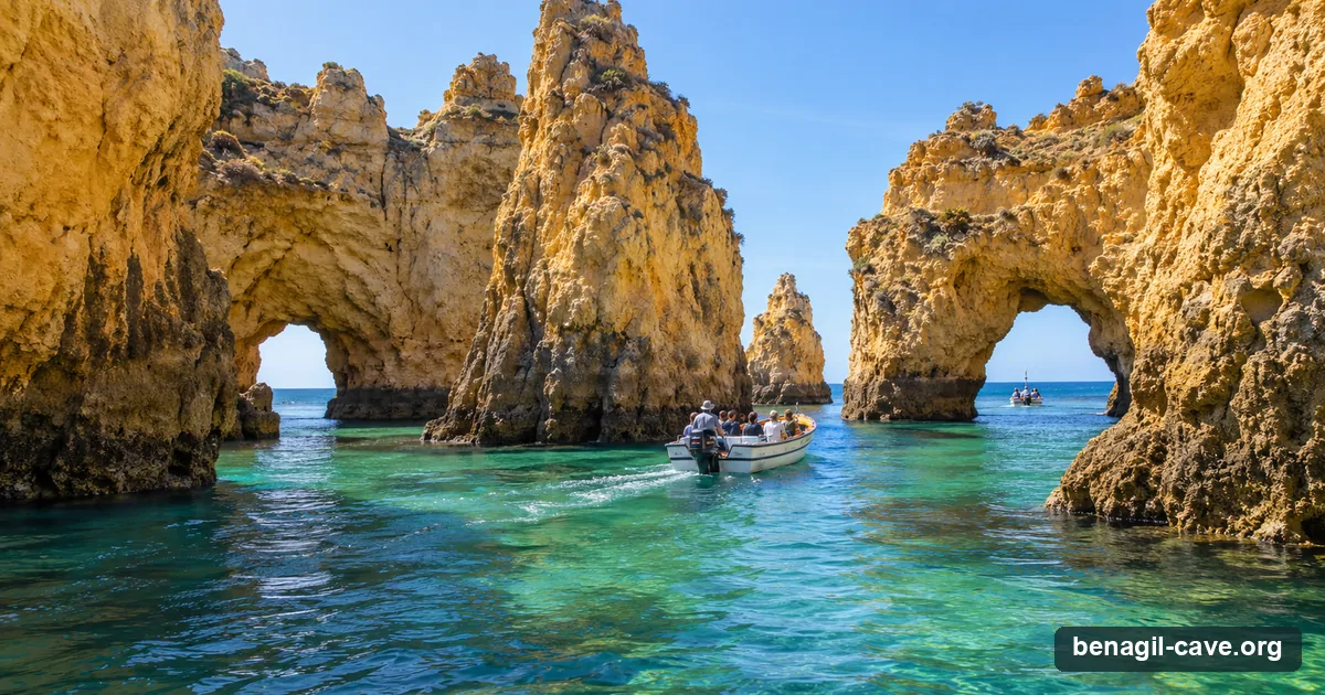 A tour boat among the sea stacks of Ponta da Piedade near Lagos on the way to Benagil